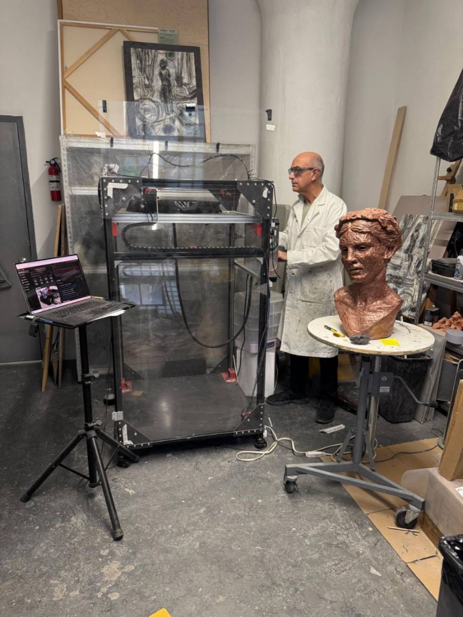 George Petrides with the large-format printer developed for his sculpture